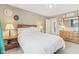 Bedroom with ensuite bath featuring a bed, white linen and natural light at 24535 Jerkwater Rd, Sheridan, IN 46069