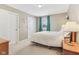 Bedroom with ensuite bath featuring a bed, white linen and natural light at 24535 Jerkwater Rd, Sheridan, IN 46069