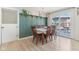 Inviting dining area featuring wainscoting and sliding glass doors to the outdoor space at 24535 Jerkwater Rd, Sheridan, IN 46069