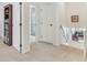 Upstairs hallway with linen closet and view to lower level at 24535 Jerkwater Rd, Sheridan, IN 46069