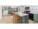 Kitchen/dining area with wood island, dark appliances, and sliding doors at 24535 Jerkwater Rd, Sheridan, IN 46069