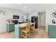 Bright eat-in kitchen features white cabinetry, black appliances, and an island at 24535 Jerkwater Rd, Sheridan, IN 46069