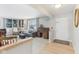 Bright, inviting living room showcasing built-in shelving, a comfortable sofa, and a seamless blend of carpet and hardwood floors at 24535 Jerkwater Rd, Sheridan, IN 46069