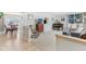 Open-concept living area boasting a seamless blend of hardwood and carpet, a comfortable rocking chair, and dining room access at 24535 Jerkwater Rd, Sheridan, IN 46069