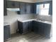 Updated kitchen with gray cabinetry, modern countertops, and stainless steel sink at 2454 Winfield Ave, Indianapolis, IN 46222
