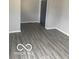 Neutral living room showcasing new vinyl flooring and fresh paint at 2454 Winfield Ave, Indianapolis, IN 46222