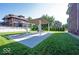 Backyard featuring a concrete patio with pergola, seating, and a well-manicured lawn at 3034 N Pennsylvania St # 1, Indianapolis, IN 46205