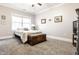 Comfortable bedroom featuring a large window, soft carpet, and stylish furnishings at 3034 N Pennsylvania St # 1, Indianapolis, IN 46205