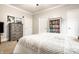 Cozy bedroom featuring a dresser and a bookshelf filled with books at 3034 N Pennsylvania St # 1, Indianapolis, IN 46205