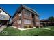 Stately brick building with well-maintained lawn and mature landscaping at 3034 N Pennsylvania St # 1, Indianapolis, IN 46205