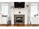 Close up view of the fireplace with custom mosaic tile and built-in shelving at 3034 N Pennsylvania St # 1, Indianapolis, IN 46205