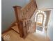 Grand foyer with hardwood floors and ornate wooden staircase leading to upper level at 3034 N Pennsylvania St # 1, Indianapolis, IN 46205