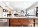 Stylish kitchen sink and countertop, with stainless steel dishwasher and views to the living spaces at 3034 N Pennsylvania St # 1, Indianapolis, IN 46205