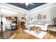 Open-concept living room with hardwood floors, a blue tray ceiling and plenty of natural light at 3034 N Pennsylvania St # 1, Indianapolis, IN 46205