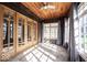 Bright sunroom with french doors, a wood ceiling and many windows at 3034 N Pennsylvania St # 1, Indianapolis, IN 46205