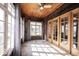 Cozy sunroom featuring tile flooring and lots of natural light at 3034 N Pennsylvania St # 1, Indianapolis, IN 46205