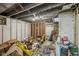 Unfinished basement with exposed walls and concrete floors at 3103 S Lockburn St, Indianapolis, IN 46221