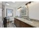 Bathroom with double sink, granite counters, updated tile and fixtures at 3103 S Lockburn St, Indianapolis, IN 46221