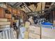 Overstuffed garage filled with boxes and debris, would make a great workshop after decluttering at 3103 S Lockburn St, Indianapolis, IN 46221