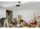 Cluttered room with a drop ceiling in disrepair at 3103 S Lockburn St, Indianapolis, IN 46221