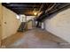 Unfinished basement with exposed ductwork, concrete floors, and cinderblock walls offers plenty of potential at 3419 Carrollton Ave, Indianapolis, IN 46205