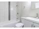 Bright bathroom featuring white subway tile, modern fixtures, and a sleek vanity at 3419 Carrollton Ave, Indianapolis, IN 46205