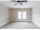 Bright bedroom with neutral walls, neutral carpet, and a large window at 3419 Carrollton Ave, Indianapolis, IN 46205