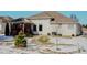 Backyard featuring a covered patio and professionally landscaped yard at 3681 S Station Dr, Columbus, IN 47203