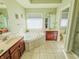 Bright bathroom with double vanities, large tub, and natural light at 3681 S Station Dr, Columbus, IN 47203