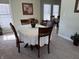Inviting dining area with carpet, a round table and seating for four at 3681 S Station Dr, Columbus, IN 47203