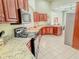 Bright kitchen featuring stainless steel appliances and tile flooring at 3681 S Station Dr, Columbus, IN 47203