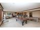 Basement featuring a billiards table, ping pong table, and a bar with seating at 3841 Falls Cir, Carmel, IN 46033