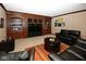 Finished basement offering a cozy seating area with built-in shelving and a TV at 3841 Falls Cir, Carmel, IN 46033