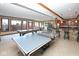 Large basement featuring a billiards table, ping pong table, and a bar with chairs at 3841 Falls Cir, Carmel, IN 46033