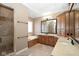 Spa-like bathroom with a soaking tub, a tiled shower, and dual vanities at 3841 Falls Cir, Carmel, IN 46033