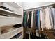 Well-organized walk-in closet featuring built-in shelves and hanging rods at 3841 Falls Cir, Carmel, IN 46033