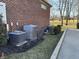 Exterior view of home showing brick facade, HVAC units and a paved driveway at 3841 Falls Cir, Carmel, IN 46033