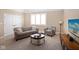 Inviting living room filled with lots of natural light and featuring comfortable, neutral furnishings at 3841 Falls Cir, Carmel, IN 46033