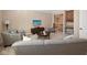 Open concept living room with neutral furnishings and a view to the home's upper level at 3841 Falls Cir, Carmel, IN 46033