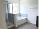Modern bathroom with a shower, tub, and vanity at 4067 Denali Dr, Indianapolis, IN 46235