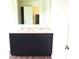 Bathroom with a double sink vanity and dark cabinetry at 4067 Denali Dr, Indianapolis, IN 46235