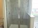 Modern bathroom with a glass enclosed shower and grey tile at 4067 Denali Dr, Indianapolis, IN 46235