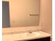 Bathroom sink with a large mirror and marble countertop at 4067 Denali Dr, Indianapolis, IN 46235