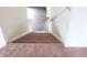 Carpeted staircase leading to a second floor with hardwood flooring at 4067 Denali Dr, Indianapolis, IN 46235