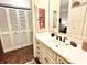 Well-lit bathroom features a modern sink, vanity and a large mirror at 430 N Park Ave # 302, Indianapolis, IN 46202