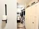 Walk in closet featuring carpet, shelving, chair and access to bathroom at 430 N Park Ave # 302, Indianapolis, IN 46202