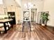 Bright dining area features modern chandelier, seating for four, and open access to other living spaces at 430 N Park Ave # 302, Indianapolis, IN 46202