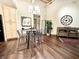Contemporary dining area with modern chandelier, seating for four, and decorative artwork at 430 N Park Ave # 302, Indianapolis, IN 46202