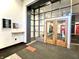 Welcoming building entrance with wood doors, directory, and secure entry system at 430 N Park Ave # 302, Indianapolis, IN 46202