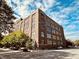 Exterior view of a brick building with beautiful windows and street view at 430 N Park Ave # 302, Indianapolis, IN 46202